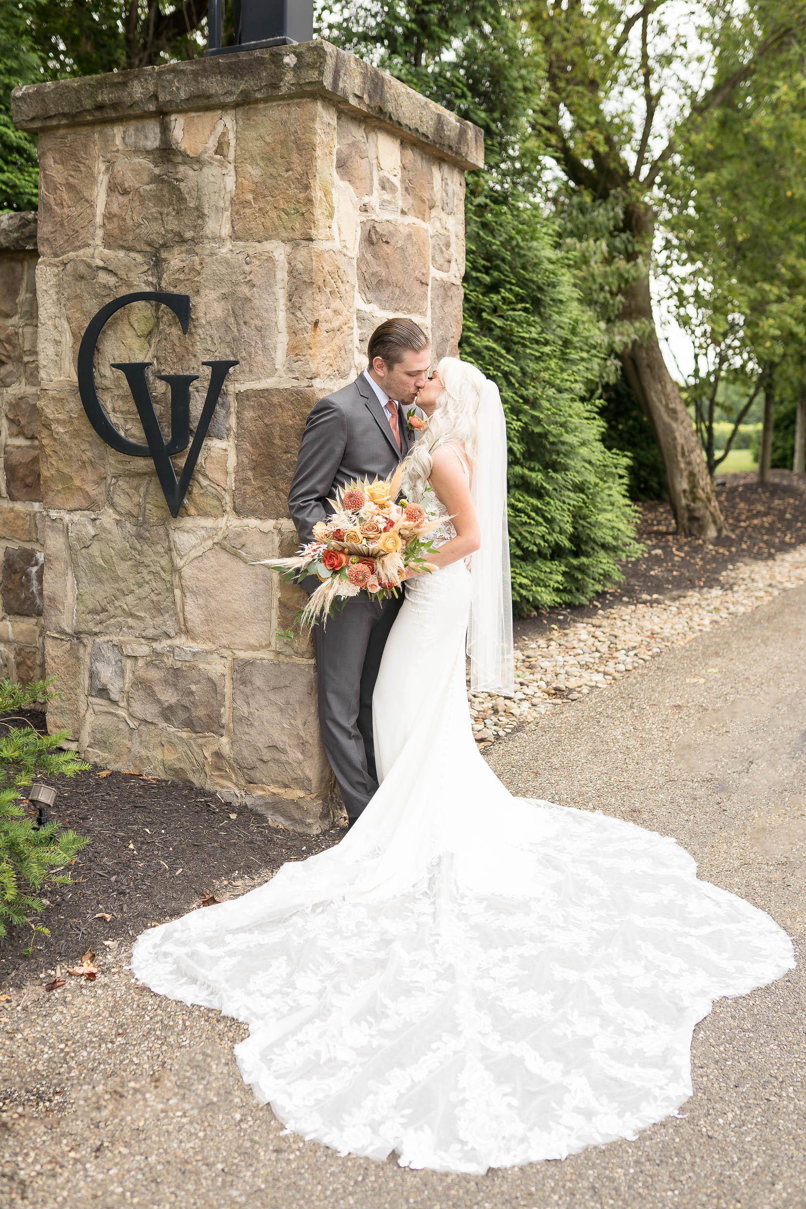 Gervasi Vineyard Wedding Photos, bride and groom at front entrance to Gervasi